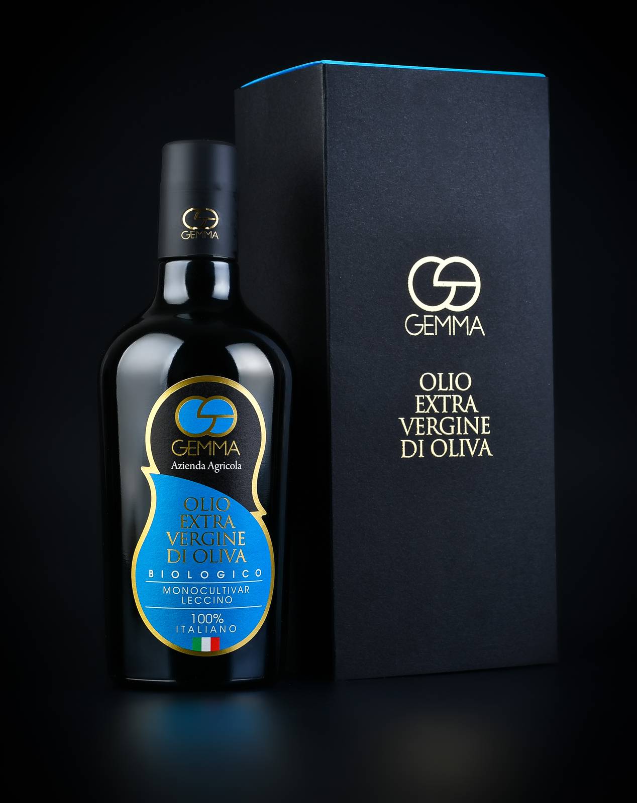 Olio Gemma, packaging still life su fondo scuro